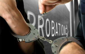 handcuffs are unlocked in front of probation sign